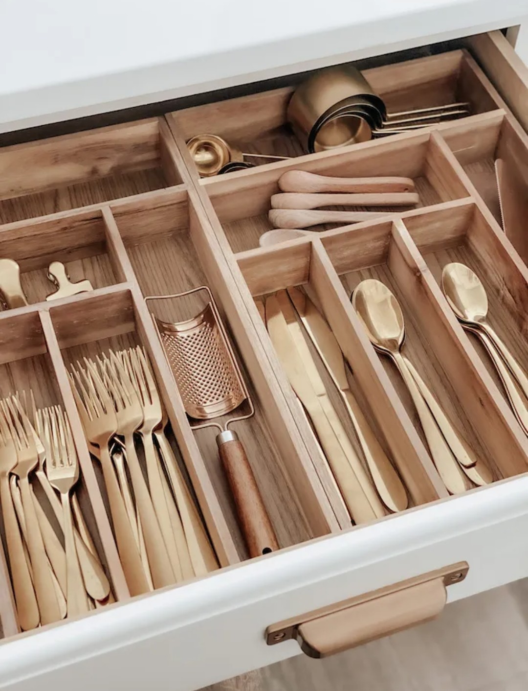 Timber drawer dividers for gold cutlery