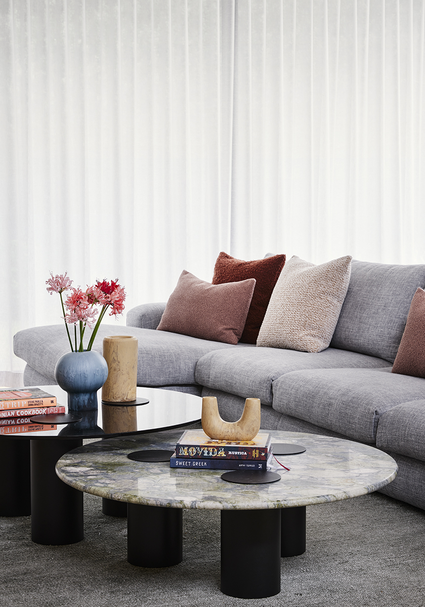 Grey couch with marble coffee tables in living room