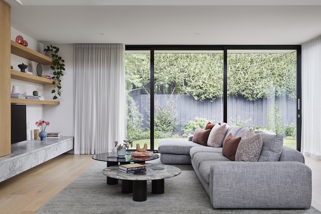 Black framed glass door in living room