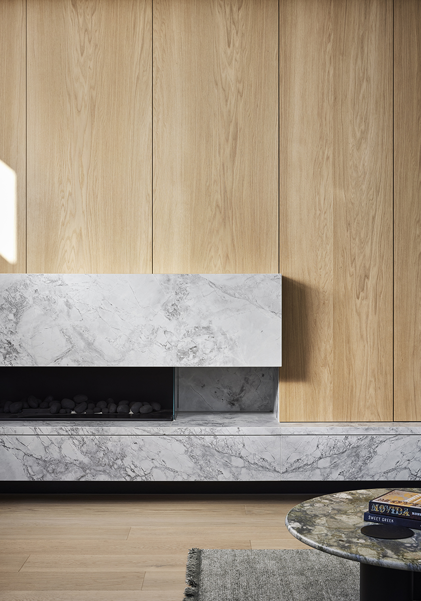 Marble plinth against timber storage in Elsternwick House