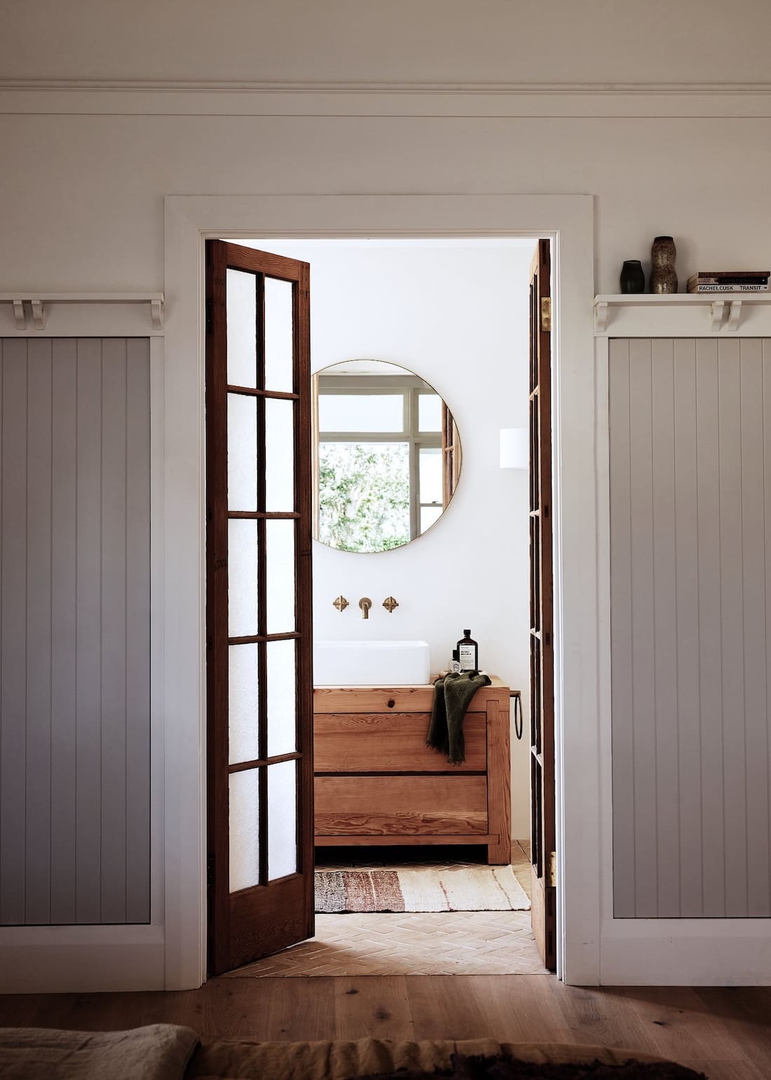 Timber and glass door into bathroom at Rocklee House