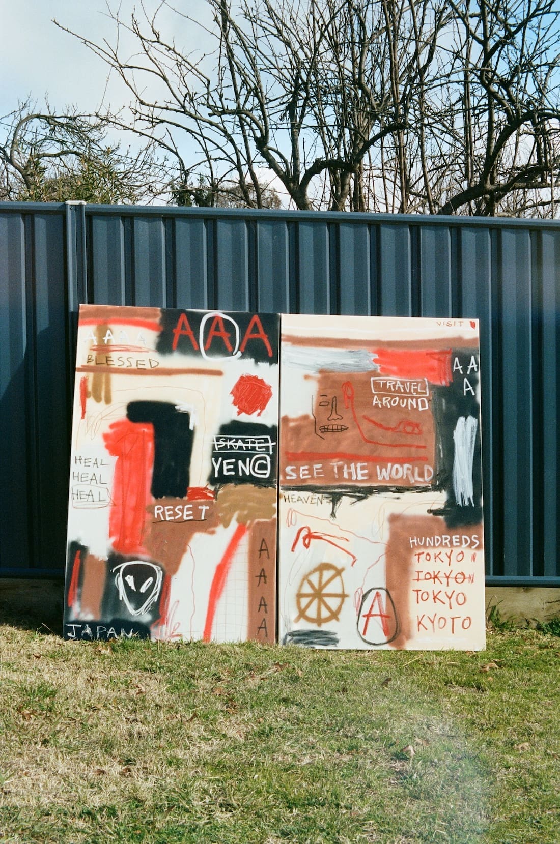 Street art canvases displayed in backyard by Musonga Mbogo