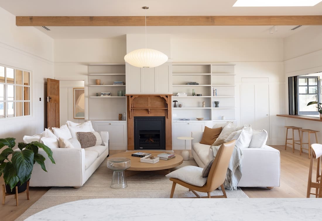 Cosy living roomwith timber fireplace at Rocklee House