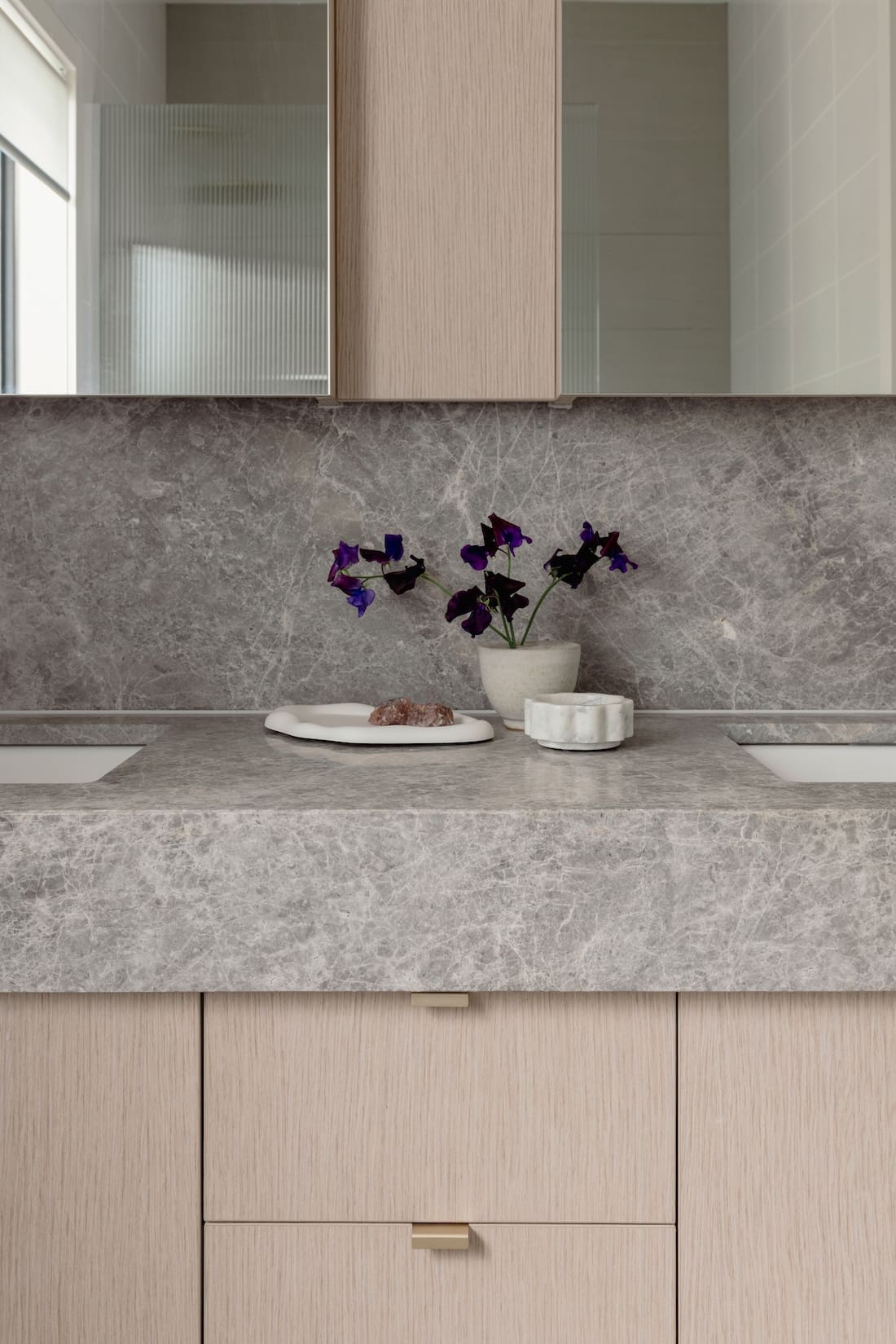 Bathroom with stone benchtops in bathroom makeover