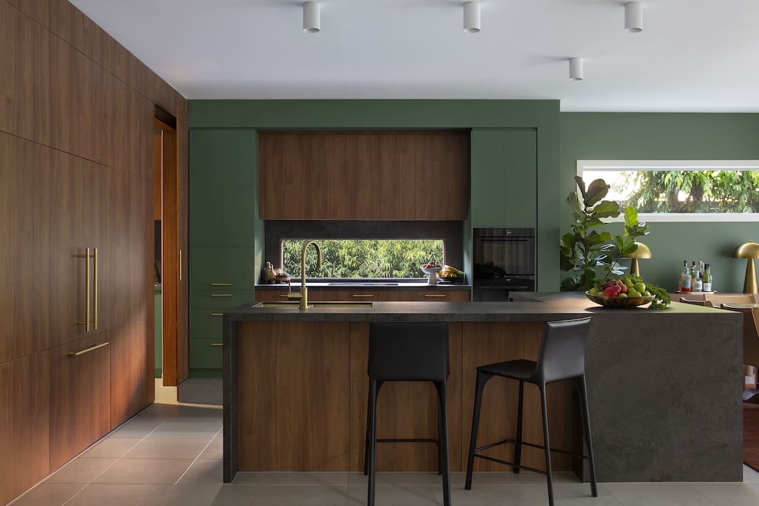 Larger island bench in kitchen of Warm Embrace residence by The Stylesmiths