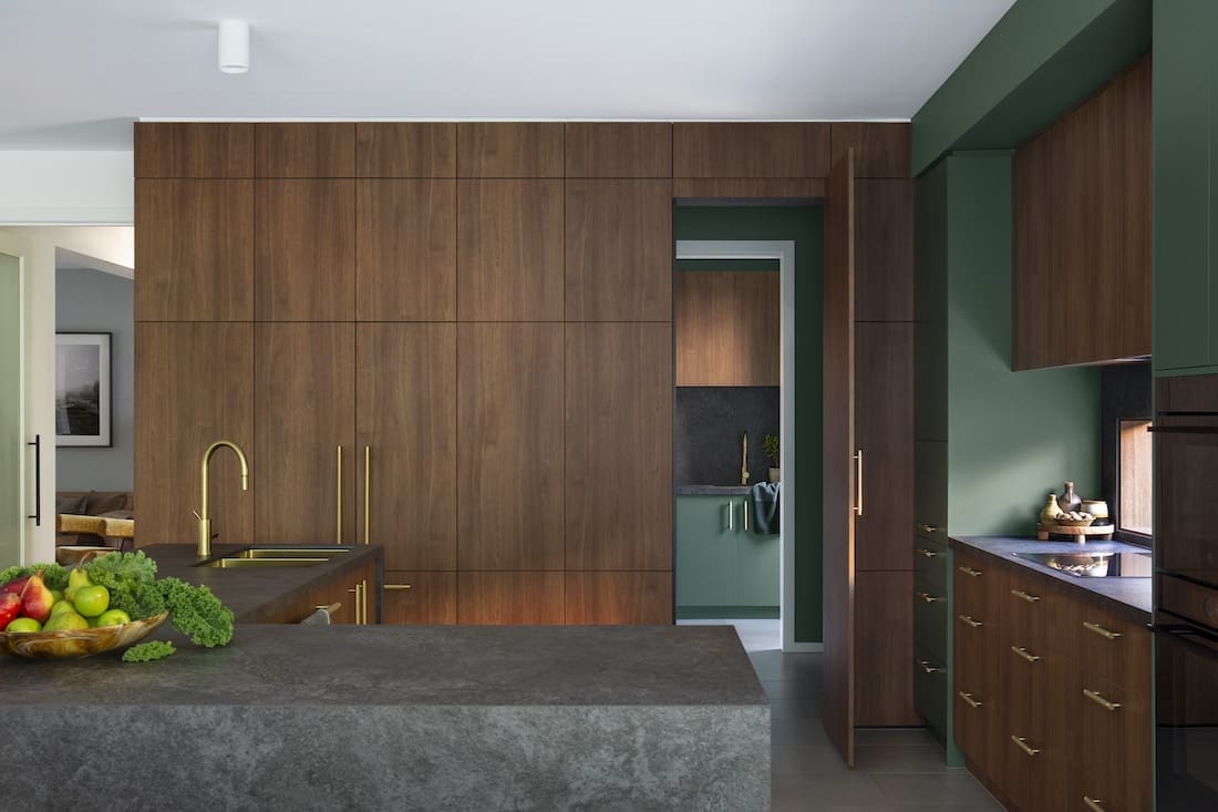 Hidden door through to walk in pantry in Warm Embrace residence by The Stylesmiths