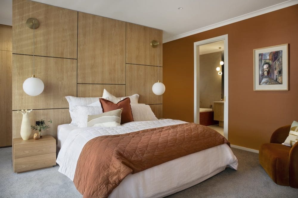 Master bedroom in Warm Embrace residence by The Stylesmiths