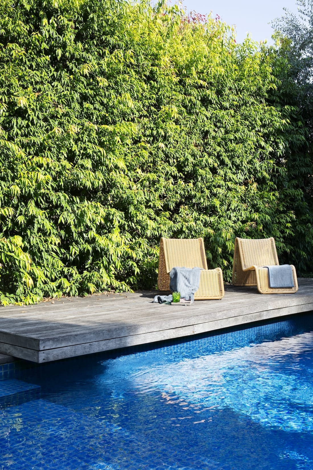 Pool area of Warm Embrace residence by The Stylesmiths