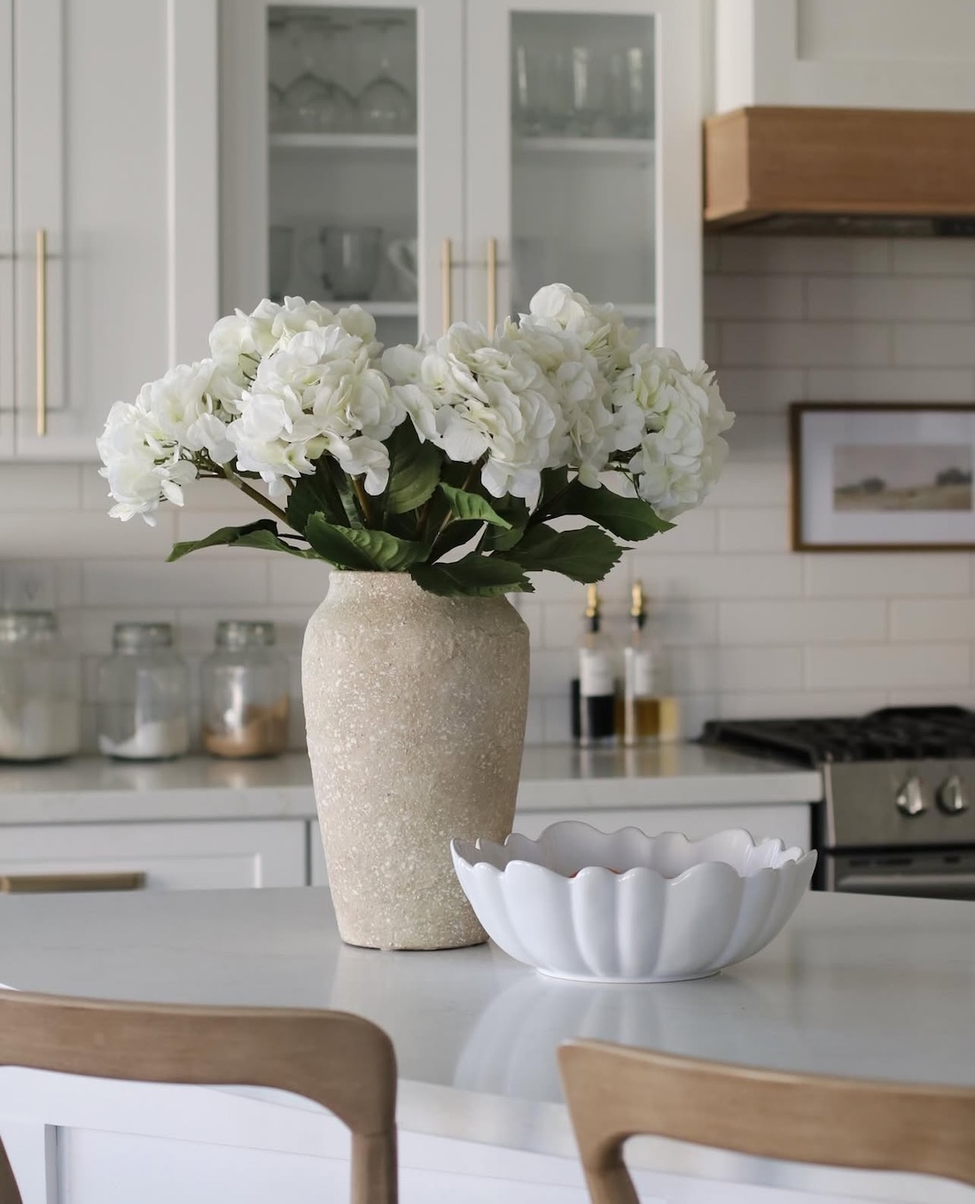 Statement vase of faux flowers in the kitchen 