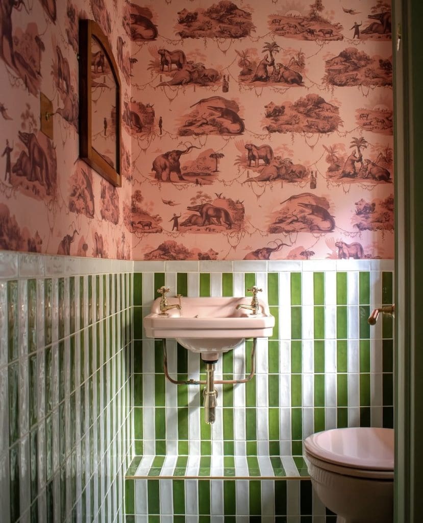 Green and white tile powder room