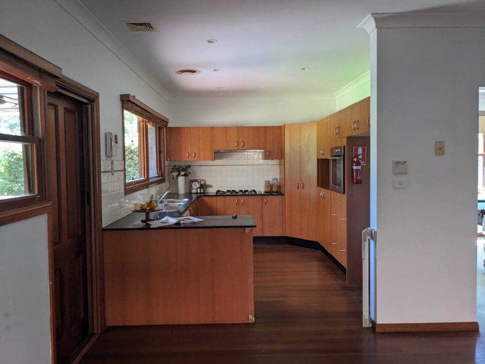 North Ryde before the makeover - 2000s red timber kitchen