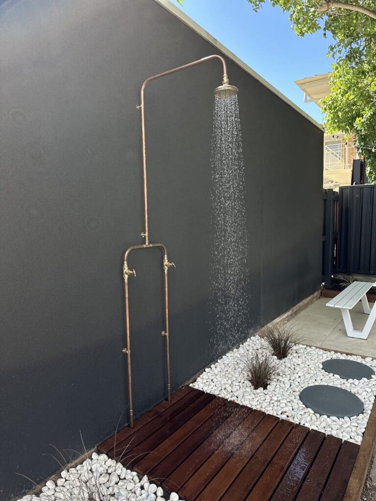 Outdoor shower at Alisa and Lysandra coastal heritage Tudor AirBnB