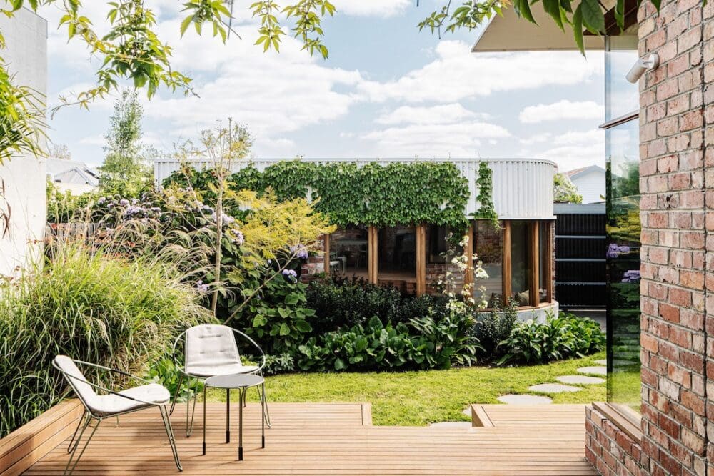 Outdoor deck looking over garden and grannyflat at Chatterbox House