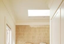 Luxe bathroom ensuite with marble vanity and double organic mirror