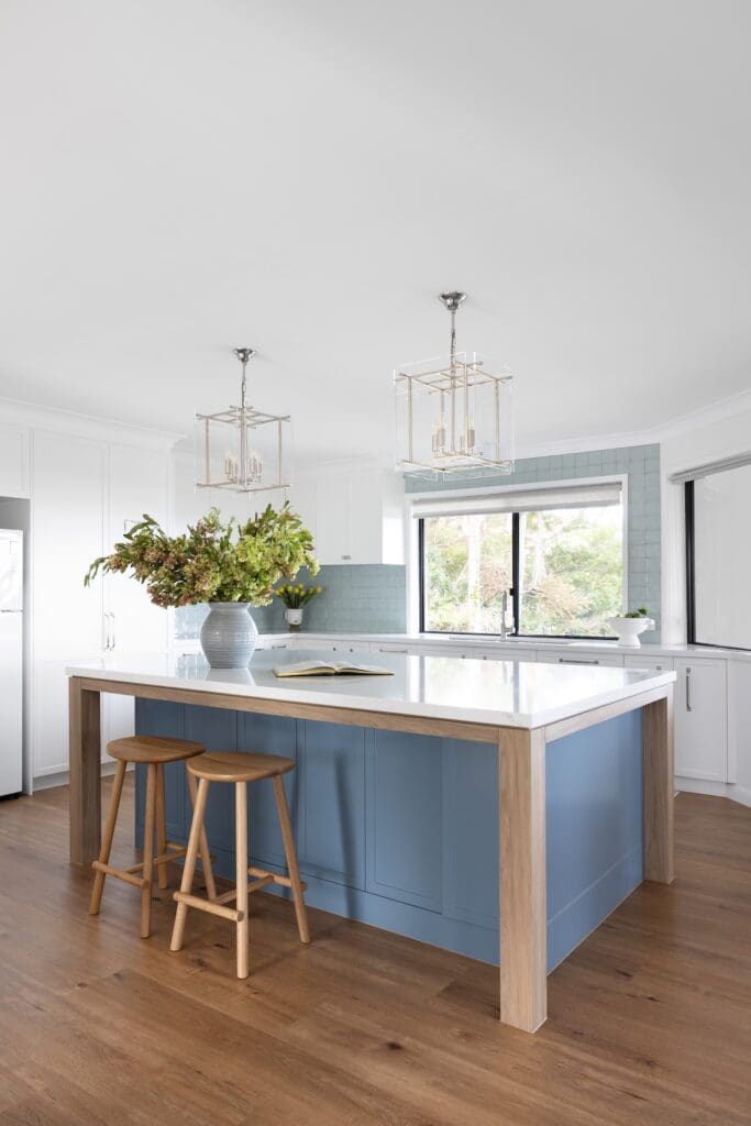 Blue kitchen island with timber legs