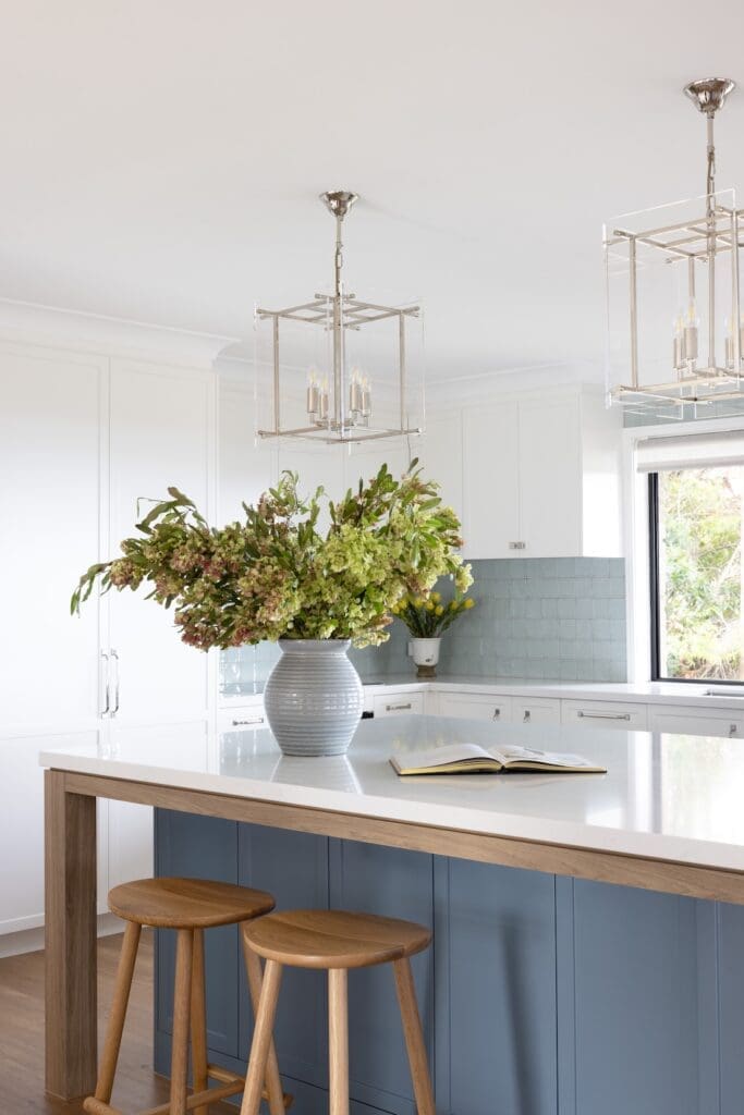 Hamptons country kitchen with blue island bench