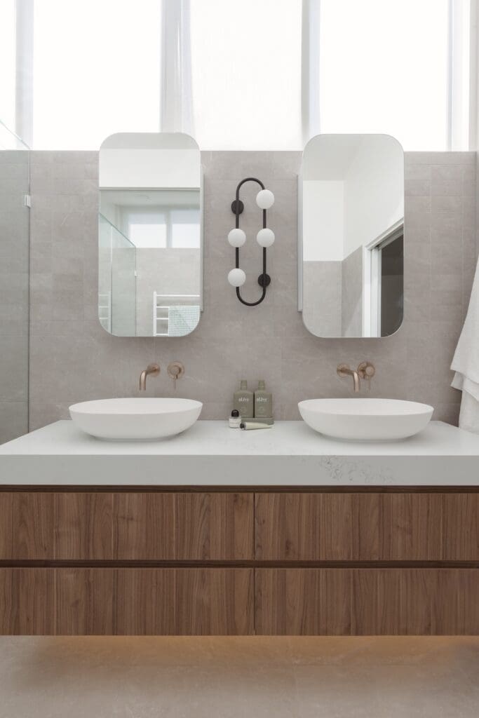 Double vanity with stadium mirror shaving cabinets