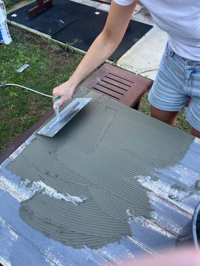 Apply tile glue