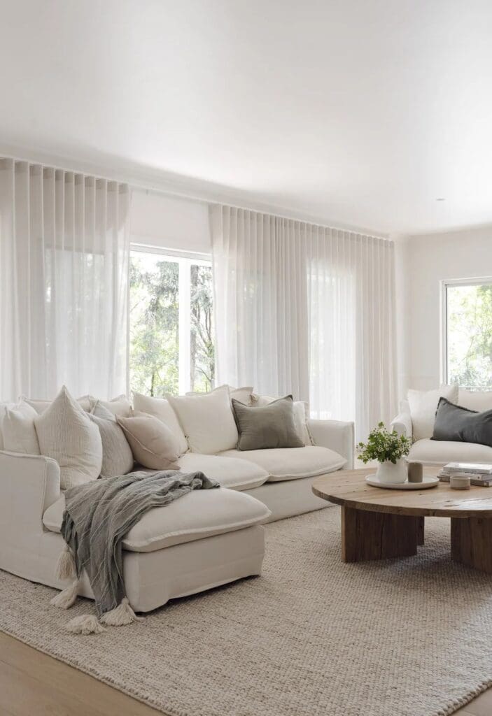 Living room with plush sofas in Ewingsdale home