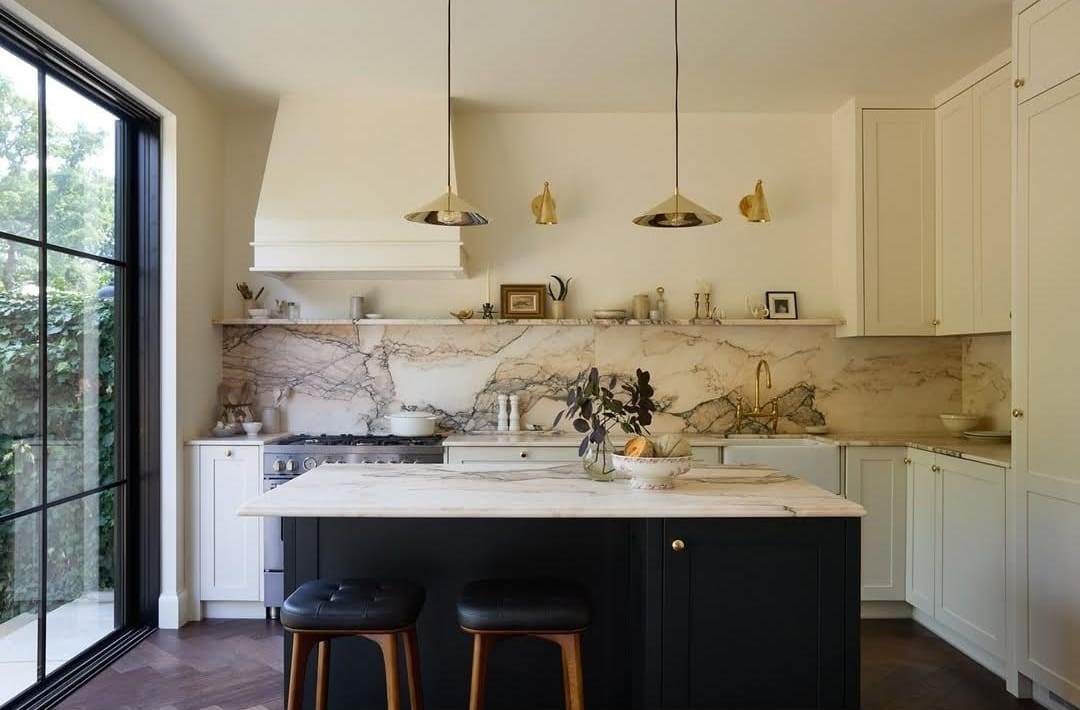 New traditional kitchen renovation bathed in luxe marble