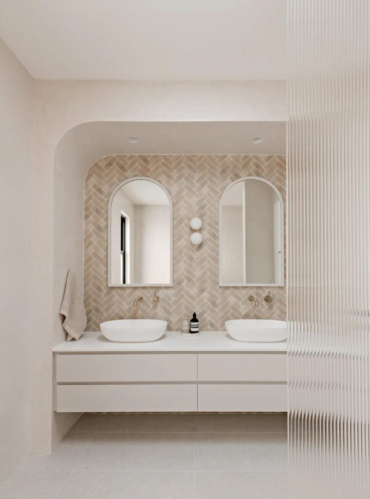Bathroom with double vanity and reeded glass at The Stables Burraneer House