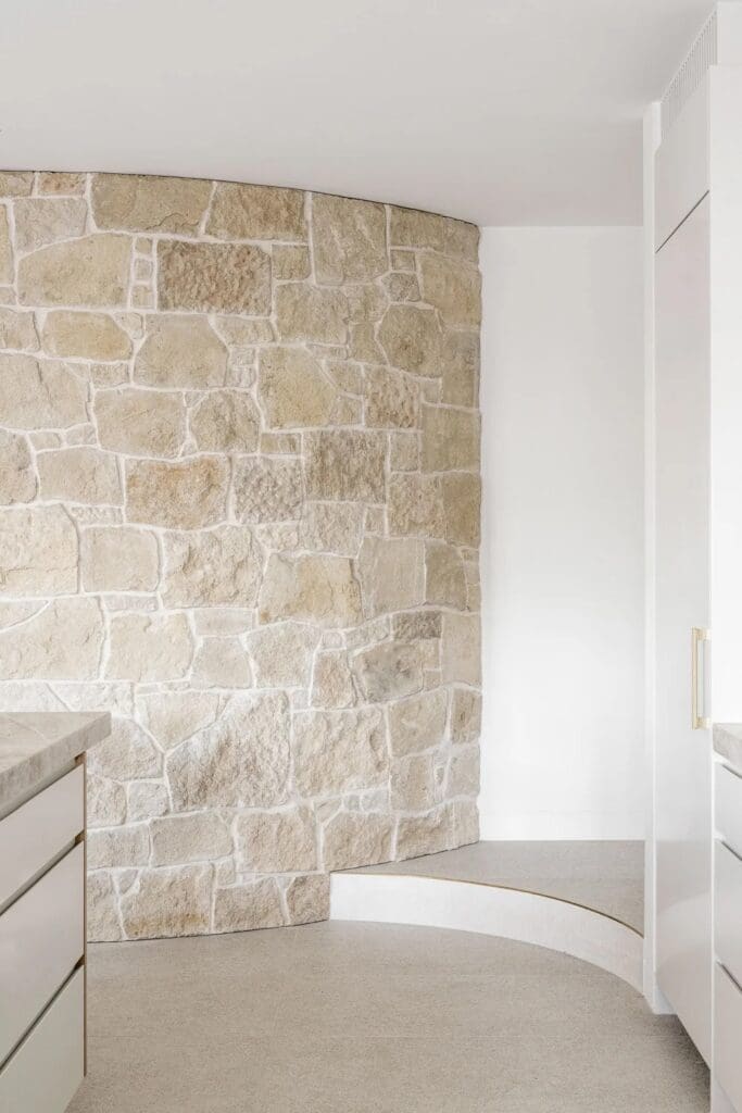 Curved natural stone wall at The Stables Burraneer House