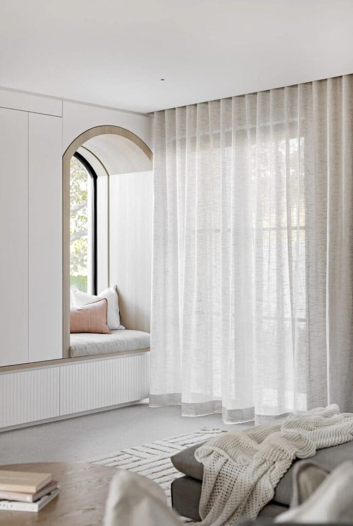 Living space with arch window seat at The Stables Burraneer House