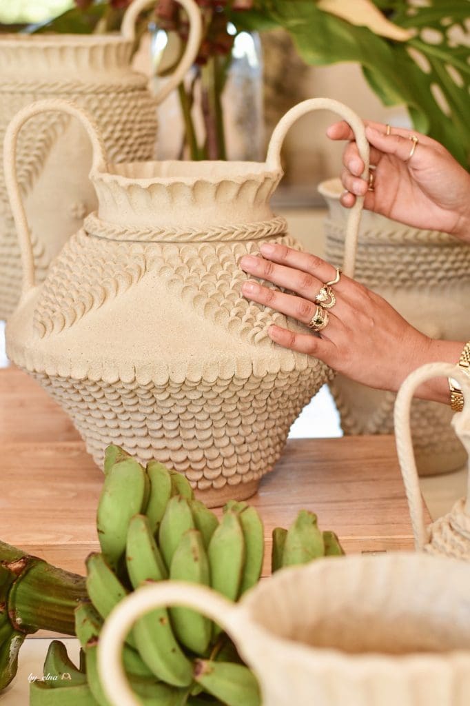 Working on vase with handles by Clayhead Ceramics