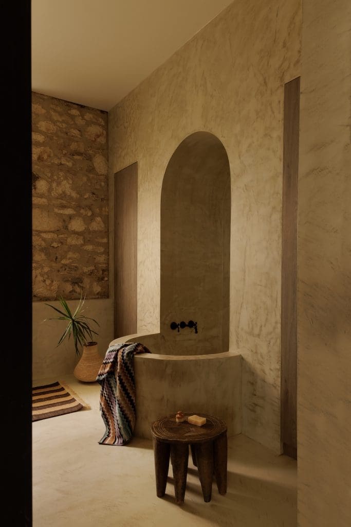 Bathroom with built in bath at Coastal Alchemy by The Stylesmiths