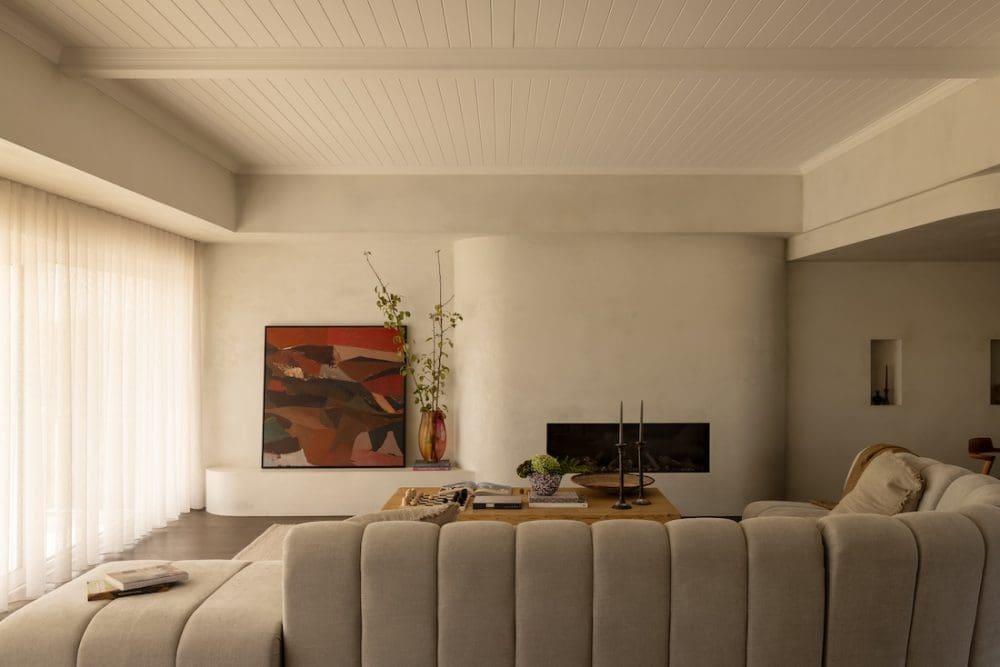 Curved fireplace at Coastal Alchemy by The Stylesmiths