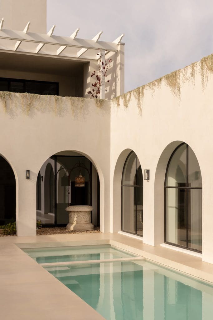 Pool with archways at Coastal Alchemy by The Stylesmiths