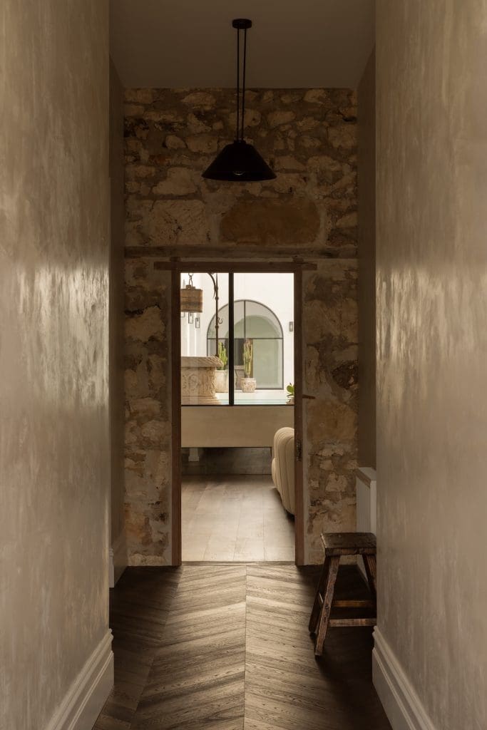 Stone and rendered walls in Coastal Alchemy by The Stylesmiths