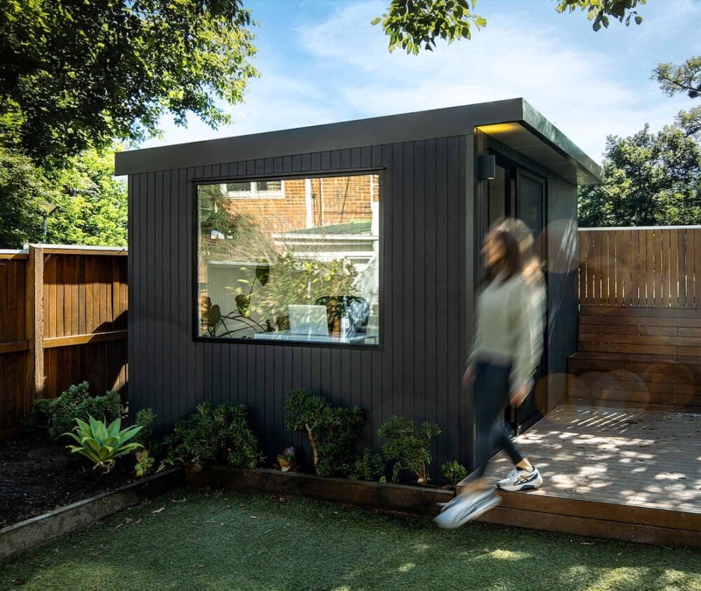 Black garden studio with large picture window
