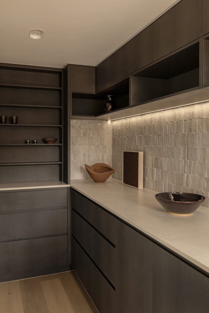Deakin home with dark timber cabinetry and tiled backsplash in Deakin Home