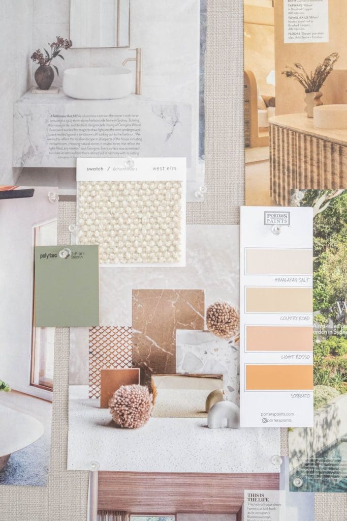 Interior design mood board with fabric swatches, paint samples, marble and timber finishes in warm neutral tones.