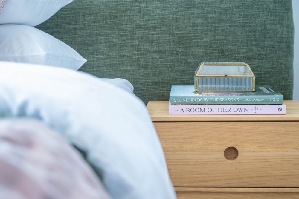 Books and trinket box on bedside