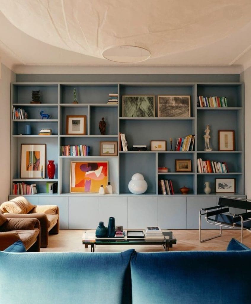 Bookshelves painted in dusty blue