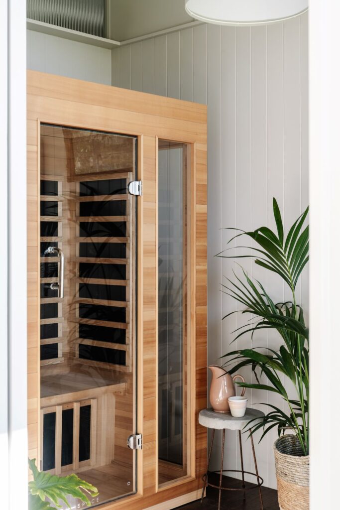Timber infrared sauna with glass door inside minimalist Mountain House by Breathe, photographed by Marnie Hawson.