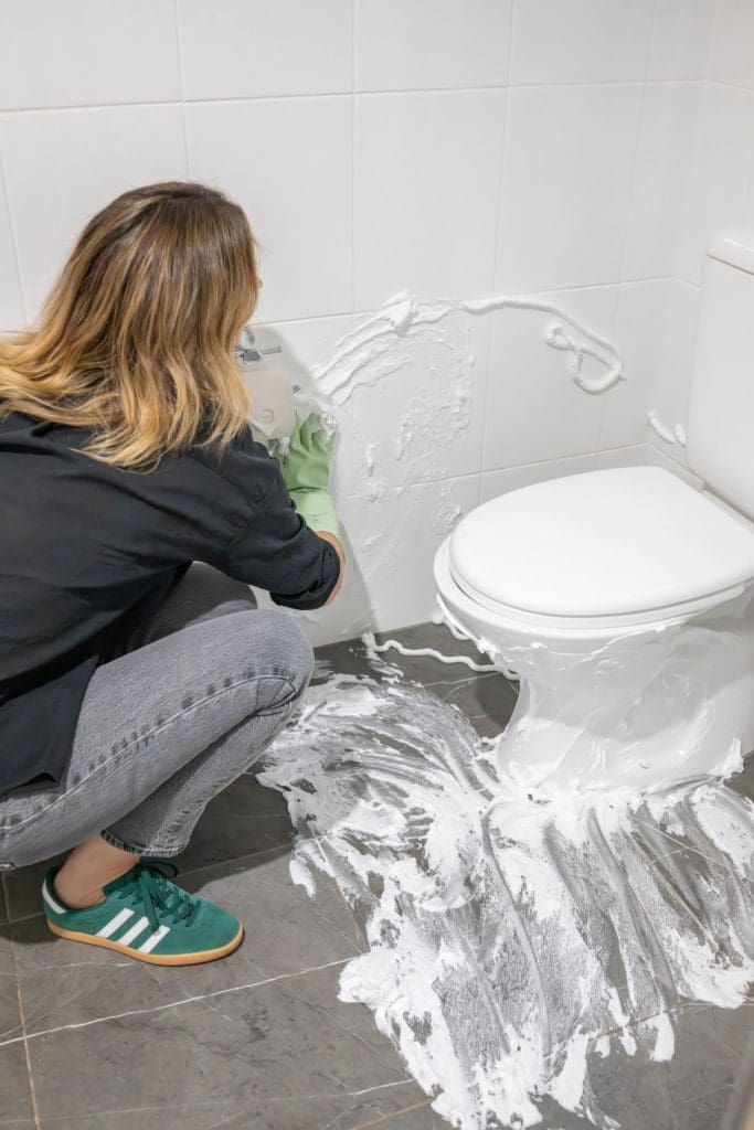 Shaving cream spread across the wall tiles
