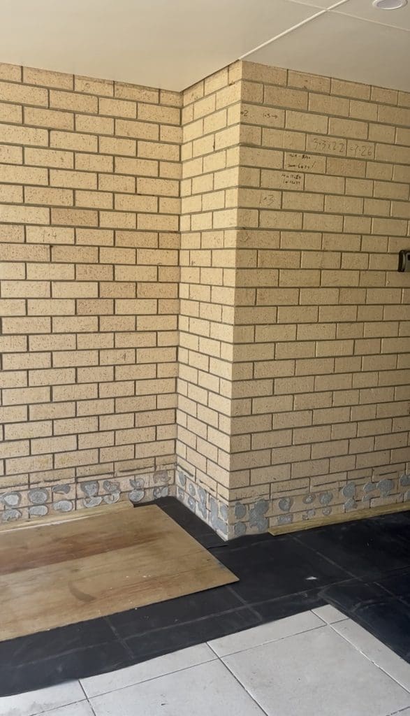 DIY stone wall makeover by Bec Riley from Rileygoodadventures - stone wall before the makeover