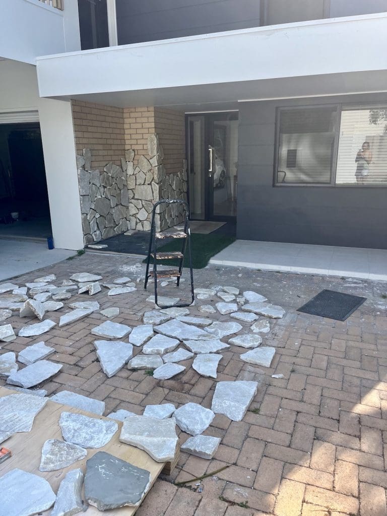 DIY stone wall makeover by Bec Riley from Rileygoodadventures - laying out the stone