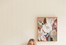 Kristin with floral artwork in background