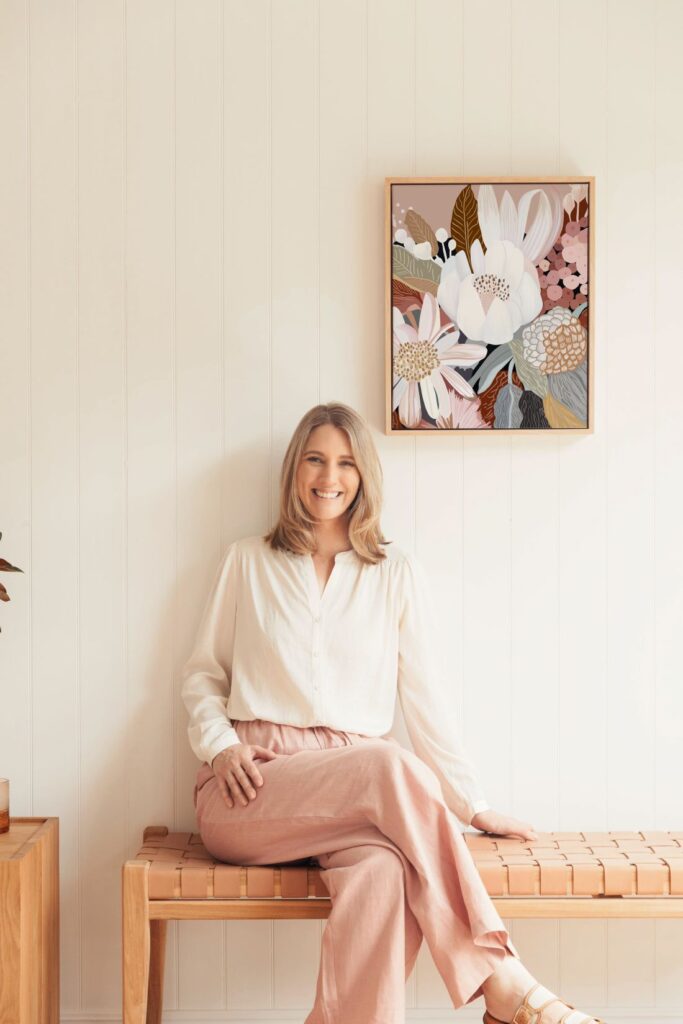 Kristin with floral artwork in background