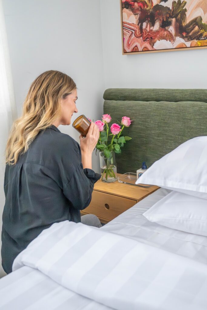 Add luxury details like fresh flowers candle and hand cream