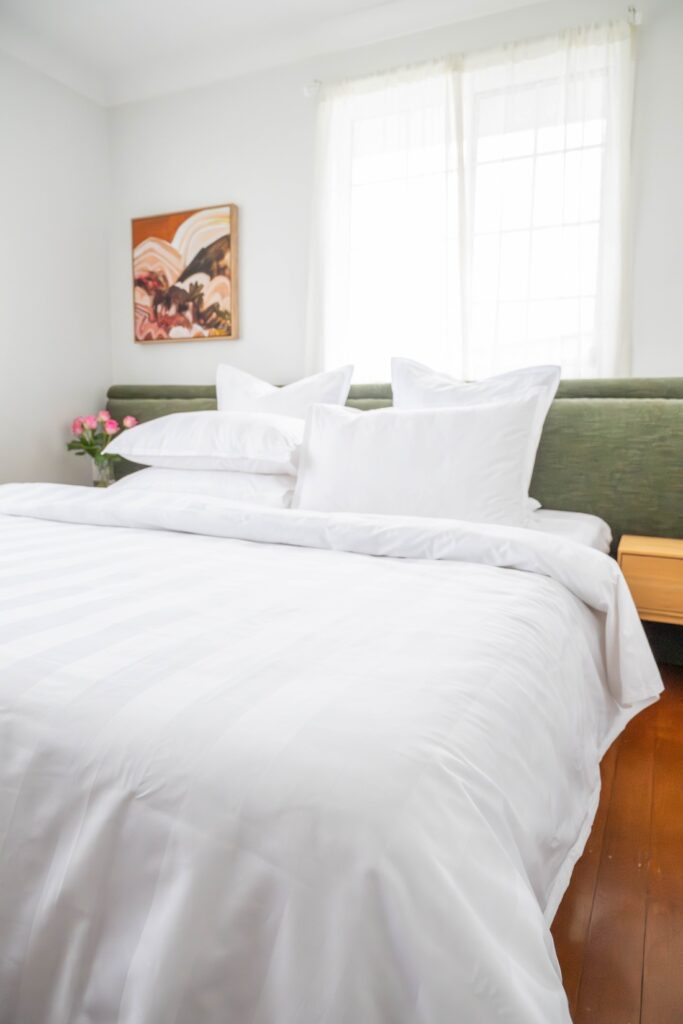 Beautiful hotel inspired bedding with subtle sateen stripe detail