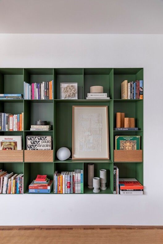 Forest green bookcase in living room