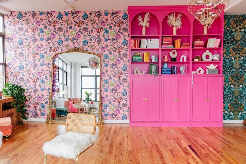Barbie pink bookcase in floral living room