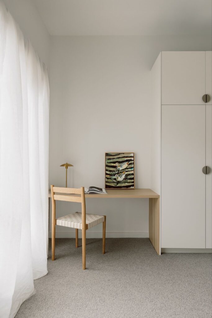 Minimalist desk and wardrobe joinery in bedroom