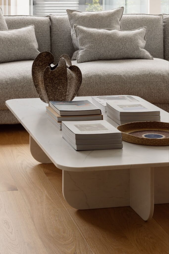 Stunning solid marble low level coffee table styled with stacks of books