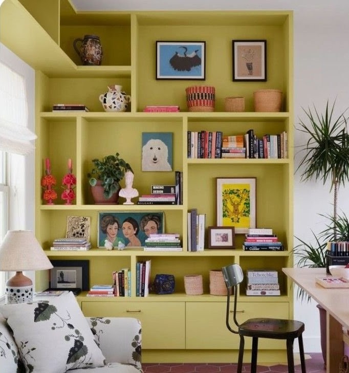 Pale green painted bookcase in living room